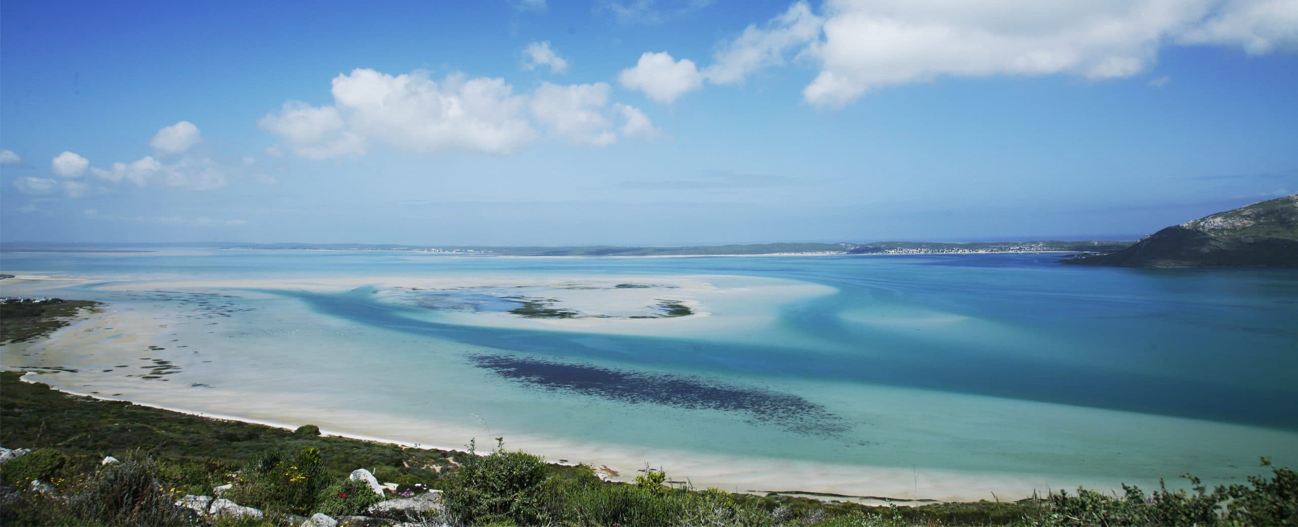 Langebaan Lagoon, its turquoise sandbars and white beach, looking across to the town